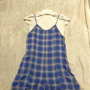 Blue plaid dress and white shirt.